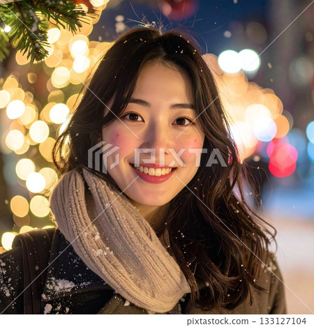 A very attractive woman with a natural smile in the snow with illuminations as a background A very attractive woman with a natural smile in the snow with illuminations as a background 133127104