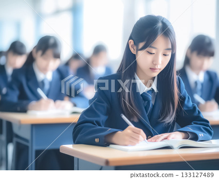 Female high school students taking classes seriously Female high school students taking classes seriously 133127489
