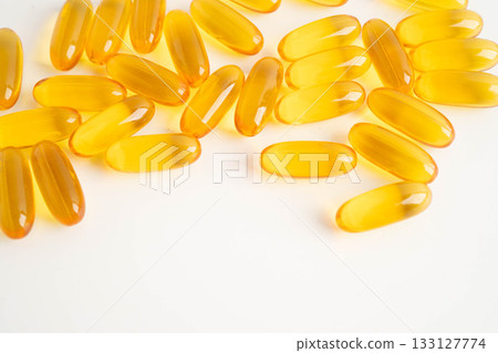 Fish oil or Cod liver oil gel in capsules with omega 3 vitamins, supplementary healthy food. 133127774
