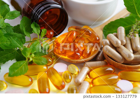 Alternative medicine herbal organic capsule with vitamin E omega 3 fish oil, mineral, drug with herbs leaf natural supplements for healthy good life. 133127779