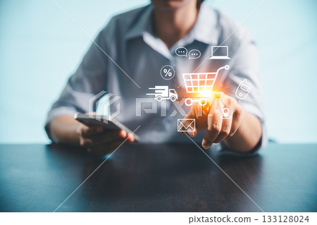 Concept of procurement technology shopper using computer or laptop for online shopping, e-commerce convenience with credit card payments, digital trolleys, fast delivery powered by modern technology. 133128024