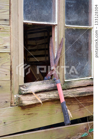 grass scissors and cabin window 133128304