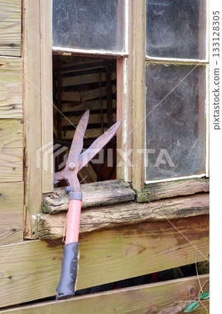 grass scissors and cabin window grass scissors and cabin window 133128305