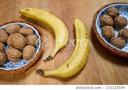 Yellow banana on wooden cutting board 133128394