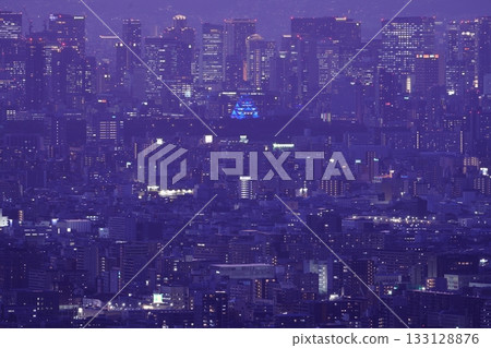 Osaka Castle lit up in blue, seen from above 133128876