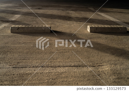 Parking lot and wheel chocks in the morning sun [Nagano Prefecture] 133129573