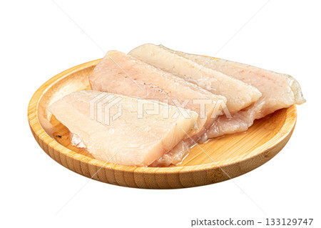 Isolated raw white fish fillets on plate 133129747