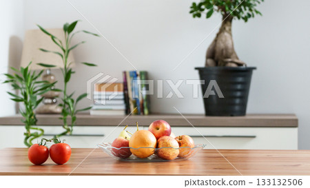 a bowl of fruit on a table in a home setting 133132506