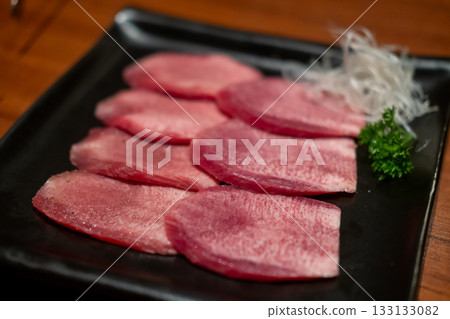 Japanese style sliced rare beef tongue meat on the plate Japanese style sliced rare beef tongue meat on the plate 133133082