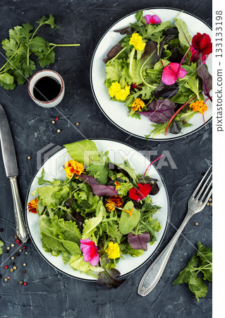 Fresh garden salad with vibrant flowers Fresh garden salad with vibrant flowers 133133198