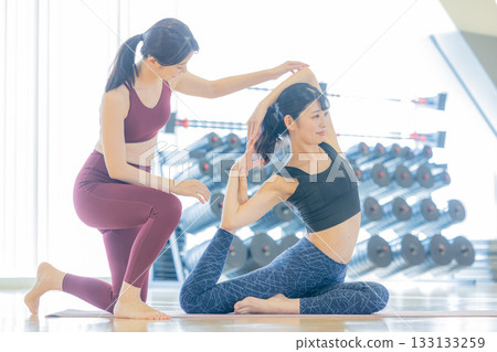 Woman stretching at the gym Woman stretching at the gym 133133259