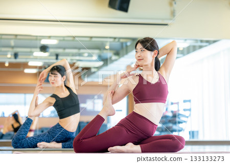 Woman doing yoga at the gym 133133273