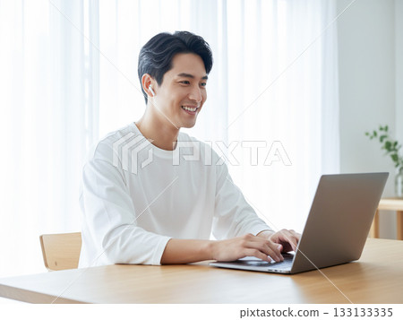 Young man working remotely Young man working remotely 133133335