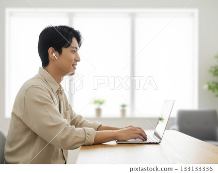 Young man working remotely Young man working remotely 133133336