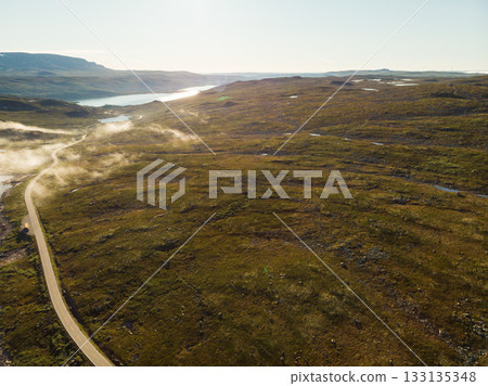 Road crossing Hardangervidda plateau, Norway. Aerial view. Road crossing Hardangervidda plateau, Norway. Aerial view. 133135348
