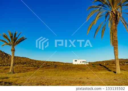 Camper on beach, camping on sea coast 133135502