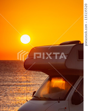 Camper car on beach at sunrise 133135520