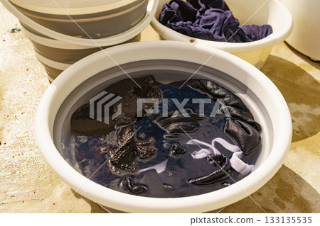 Washing laundry on holidays trip. 133135535