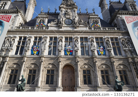 City Hall of Paris, France building adorned with colorful flags and rich architecture City Hall of Paris, France building adorned with colorful flags and rich architecture 133136271