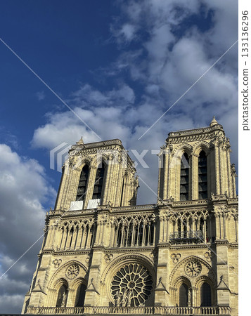 Majestic Notre-Dame Cathedral stands under a bright blue sky in Paris Majestic Notre-Dame Cathedral stands under a bright blue sky in Paris 133136296
