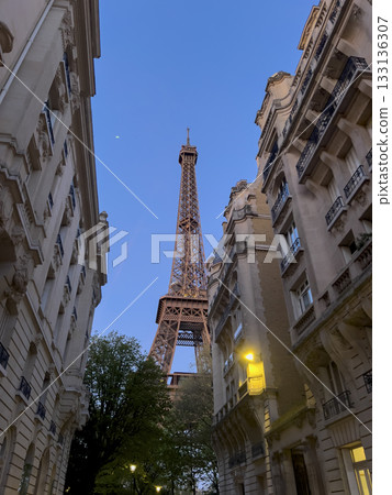 View of Eiffel Tower from a charming Paris street at dusk View of Eiffel Tower from a charming Paris street at dusk 133136307