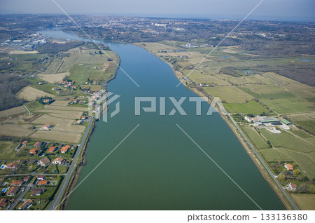 Scenic aerial view of the Adour river in Urt, Landes region 133136380