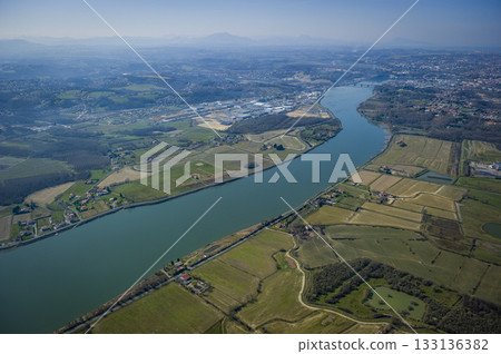 Scenic aerial view of the Adour river in Urt, Landes region 133136382