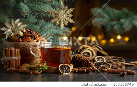 Tea with spices and dry fruits on a kitchen table. Tea with spices and dry fruits on a kitchen table. 133136749