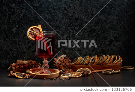 Mulled wine with ingredients and dry orange slices. Mulled wine with ingredients and dry orange slices. 133136766