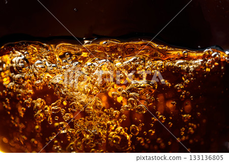 Macro shot of cooling drink with bubbles in motion. Macro shot of cooling drink with bubbles in motion. 133136805