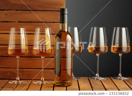 White wine on a wooden background. White wine on a wooden background. 133136832