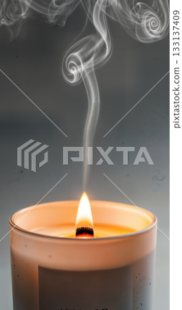 Luxury Candle With Wooden Wick, Festive Container, and Smoke Wisps Against Soft Neutral Background Luxury Candle With Wooden Wick, Festive Container, and Smoke Wisps Against Soft Neutral Background 133137409