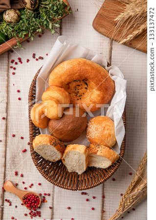 Assorted bread in wicker basket Assorted bread in wicker basket 133137472