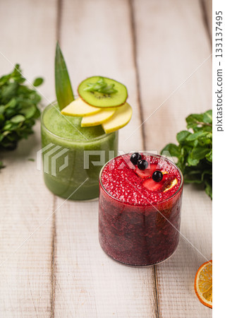 Green and berry smoothies in glasses 133137495