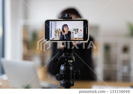 Caucasian woman at workspace recording blog about relaxation techniques, dancing, listening music. Caucasian woman at workspace recording blog about relaxation techniques, dancing, listening music. 133138048