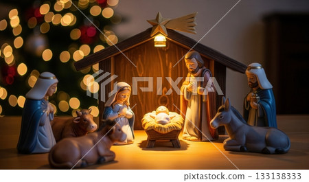 A nativity scene showing the birth of Jesus, set against a Christmas tree with bokeh lights. The warm glow creates a peaceful and magical atmosphere. Perfect for holiday cards or web banners. 133138333