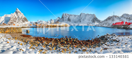 Amazing winter view of Sakrisoy village and snowy mountaines on background. 133140381