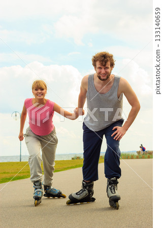 roller skater couple skating outdoor 133140659