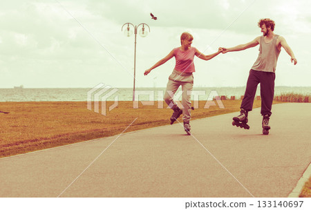 roller skater couple skating outdoor 133140697