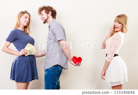 Sneaky man with two women 133140848