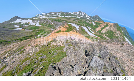 View of the snow-capped mountains from the summit of Akadake in Daisetsuzan, Hokkaido 133141494