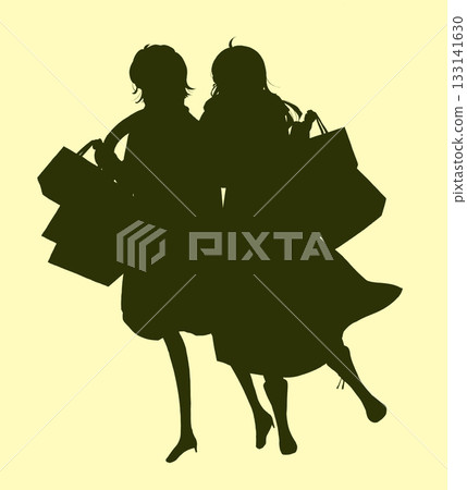 Two women carrying lots of shopping bags Winter silhouette Two women carrying lots of shopping bags Winter silhouette 133141630