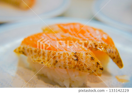 Broiled salmon sushi 133142229