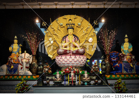 Serene Buddha Statue Amid Colorful Shrine Decor For Meditation, Peace, And Spirituality Serene Buddha Statue Amid Colorful Shrine Decor For Meditation, Peace, And Spirituality 133144461