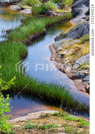 Rocks around public sea bath of Saltholmen peninsula on shore of Alvsborgsfjorden harbour, Alvsborg district, sunny day, Gothenburg, Sweden Rocks around public sea bath of Saltholmen peninsula on shore of Alvsborgsfjorden harbour, Alvsborg district, sunny day, Gothenburg, Sweden 133145014