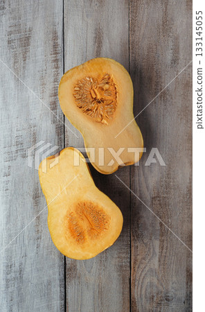 Pieces of ripe pumpkin on the table. Kitchen. Autumn. Cooking. Food background. Thanksgiving. Orange pumpkin. Banner. 133145055