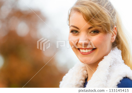 Young woman spend time in autumnal park. Young woman spend time in autumnal park. 133145415