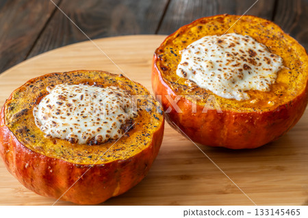 Baked Hokkaido pumpkins filled with beef, tomato sauce, melted mozzarella Baked Hokkaido pumpkins filled with beef, tomato sauce, melted mozzarella 133145465