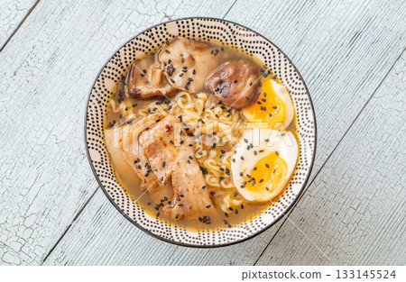 Bowl of ramen with pork belly, soft egg, and shiitake mushrooms 133145524