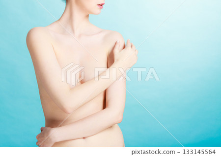 Bare woman covering her breast with hands Bare woman covering her breast with hands 133145564